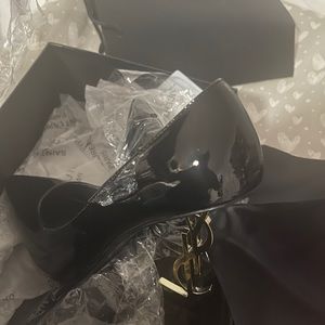 Yves St-Laurent shoes size 38. Can fit size 7. Never Worn